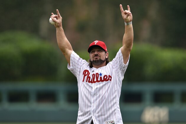 WWE's superstar A.J. Styles throws out the ceremonial opening pitch prior to a baseball game between the Philadelphia Phillies and the Milwaukee Brewers, Sunday, July 23, 2017, in Philadelphia. (AP Photo/Derik Hamilton)