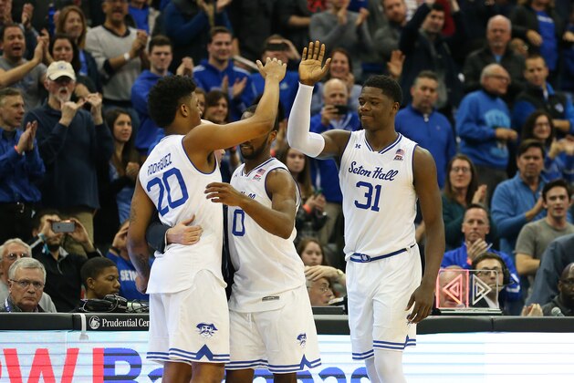 NEWARK, NJ - MARCH 03: Head coach Kevin Willard of the Seton Hall Pirates his his senior players Desi Rodriguez #20, Khadeen Carrington #0 and Angel Delgado #31 after playing in their final home game of their career against the Butler Bulldogs at Prudential Center on March 3, 2018 in Newark, New Jersey. Seton Hall defeated Butler 77-70. (Photo by Rich Schultz/Getty Images)