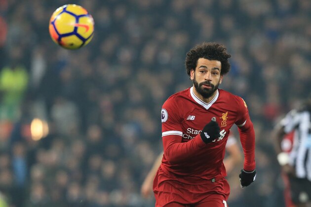 Liverpool's Egyptian midfielder Mohamed Salah chases the ball during the English Premier League football match between Liverpool and Newcastle at Anfield in Liverpool, north west England on March 3, 2018. / AFP PHOTO / Lindsey PARNABY / RESTRICTED TO EDITORIAL USE. No use with unauthorized audio, video, data, fixture lists, club/league logos or 'live' services. Online in-match use limited to 75 images, no video emulation. No use in betting, games or single club/league/player publications.  /         (Photo credit should read LINDSEY PARNABY/AFP/Getty Images)