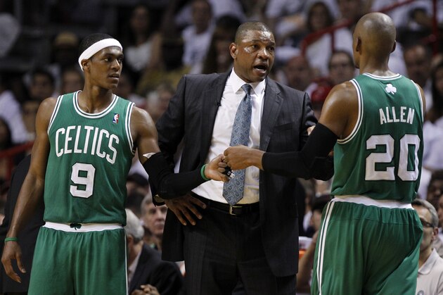Boston Celtics' Doc Rivers, center,  talks to Boston Celtics' Ray Allen (20) and Rajon Rondo (9) during the second half of Game 5 in their NBA basketball Eastern Conference finals playoffs series, Tuesday, June 5, 2012, in Miami. (AP Photo/Lynne Sladky)