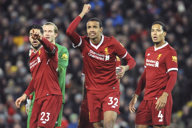 Liverpool's Emre Can, Loris Karius, Joel Matip, Virgil van Dijk, from left to right, react during the English Premier League soccer match between Liverpool and Tottenham Hotspur at Anfield, Liverpool, England, Sunday, Feb. 4, 2018. (AP Photo/Rui Vieira)