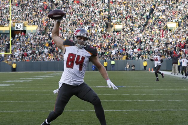 Tampa Bay Buccaneers' Cameron Brate celebrates his touchdown catch during the second half of an NFL football game against the Green Bay Packers Sunday, Dec. 3, 2017, in Green Bay, Wis. (AP Photo/Matt Ludtke)