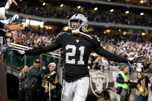 OAKLAND, CA - DECEMBER 17:  Sean Smith #21 of the Oakland Raiders celebrates after intercepting a pass by Dak Prescott #4 of the Dallas Cowboys during their NFL game at Oakland-Alameda County Coliseum on December 17, 2017 in Oakland, California.  (Photo by Lachlan Cunningham/Getty Images)