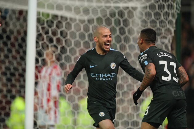 STOKE ON TRENT, ENGLAND - MARCH 12: David Silva of Manchester City celebrates after scoring a goal to make it 2-0 during the Premier League match between Stoke City and Manchester City at Bet365 Stadium on March 12, 2018 in Stoke on Trent, England. (Photo by Matthew Ashton - AMA/Getty Images)