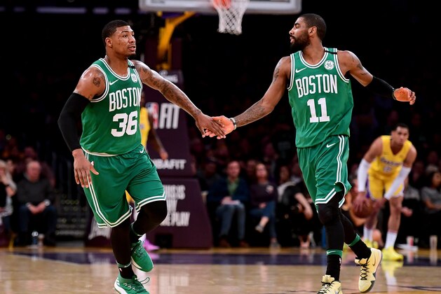 LOS ANGELES, CA - JANUARY 23:  Marcus Smart #36 of the Boston Celtics celebrates his three pointer with Kyrie Irving #11 against the Los Angeles Lakers during the first half at Staples Center on January 23, 2018 in Los Angeles, California.  (Photo by Harry How/Getty Images)