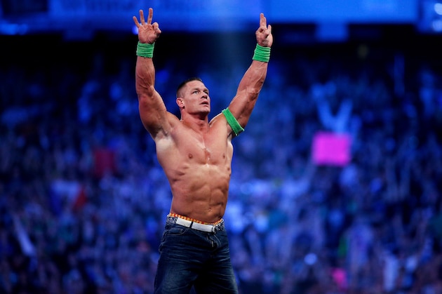 FILE- In this Sunday, April 6, 2014 file photo, John Cena celebrates his win during Wrestlemania XXX at the Mercedes-Benz Super Dome in New Orleans. World-famous WWE wrestlers such as John Cena, Shaemus and champion Randy Orton are in Saudi Arabia for three days of matches in the capital Riyadh. (Jonathan Bachman/AP Images for WWE, File)