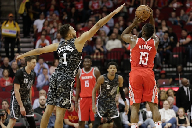 HOUSTON, TX - MARCH 12:  James Harden #13 of the Houston Rockets shoots a three point basket over Kyle Anderson #1 of the San Antonio Spurs at Toyota Center on March 12, 2018 in Houston, Texas. NOTE TO USER: User expressly acknowledges and agrees that, by downloading and or using this photograph, User is consenting to the terms and conditions of the Getty Images License Agreement.  (Photo by Bob Levey/Getty Images)