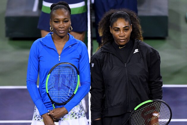 INDIAN WELLS, CA - MARCH 12:  Venus Williams and Serena Williams pose for a photo before their match against each other during the BNP Paribas Open at the Indian Wells Tennis Garden on March 12, 2018 in Indian Wells, California.  (Photo by Harry How/Getty Images)