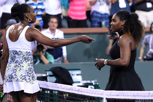 INDIAN WELLS, CA - MARCH 12: Venus Williams (L) of United States hug Serena Williams after her win over her sister during Day 8 of BNP Paribas Open on March 12, 2018 in Indian Wells, California. (Photo by Kevork Djansezian/Getty Images)