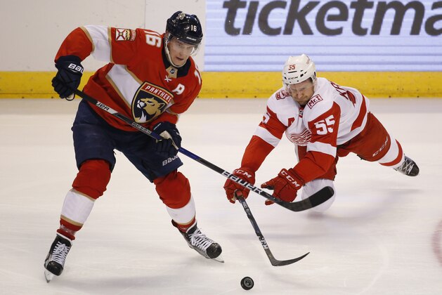 Florida Panthers center Aleksander Barkov (16) and Detroit Red Wings defenseman Niklas Kronwall (55) battle for the puck during the second period of an NHL hockey game, Saturday, Feb. 3, 2018 in Sunrise, Fla. (AP Photo/Wilfredo Lee)