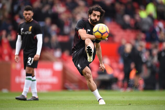Liverpool's Egyptian midfielder Mohamed Salah warms up ahead of English Premier League football match between Manchester United and Liverpool at Old Trafford in Manchester, north west England, on March 10, 2018. / AFP PHOTO / Oli SCARFF / RESTRICTED TO EDITORIAL USE. No use with unauthorized audio, video, data, fixture lists, club/league logos or 'live' services. Online in-match use limited to 75 images, no video emulation. No use in betting, games or single club/league/player publications.  /         (Photo credit should read OLI SCARFF/AFP/Getty Images)