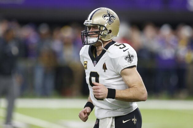 New Orleans Saints quarterback Drew Brees (9) warms up before an NFL divisional football playoff game against the Minnesota Vikings in Minneapolis, Sunday, Jan. 14, 2018. (AP Photo/Jim Mone)