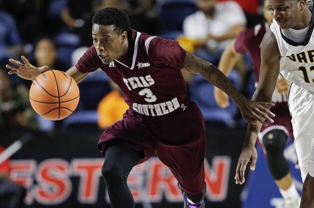 Texas Southern guard Demontrae Jefferson (3) and Arkansas-Pine Bluff guard Joe'Randle Toliver (13) chase the ball during the second half of an NCAA college basketball game in the championship of the Southwestern Athletic Conference, Saturday, March 10, 2018, in Houston. (AP Photo/Eric Christian Smith)