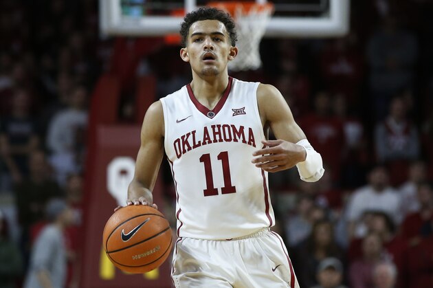 Oklahoma guard Trae Young (11) in the second half of an NCAA college basketball game against Texas in Norman, Okla., Saturday, Feb. 17, 2018. (AP Photo/Sue Ogrocki)