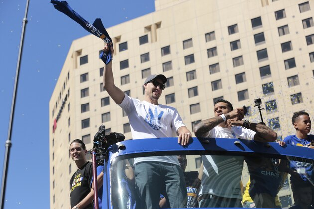 OAKLAND, CA - JUNE 15:  Klay Thompson #11 and Matt Barnes #22 of the Golden State Warriors celebrates winning the 2017 NBA Championship during a parade on June 15, 2017 in Oakland, CA.  NOTE TO USER: User expressly acknowledges and agrees that, by downloading and/or using this Photograph, user is consenting to the terms and conditions of the Getty Images License Agreement. Mandatory Copyright Notice: Copyright 2017 NBAE (Photo by Jack Arent/NBAE via Getty Images)