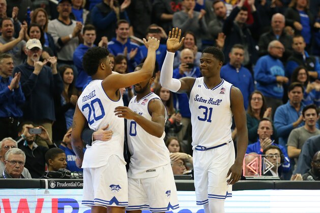 NEWARK, NJ - MARCH 03: Head coach Kevin Willard of the Seton Hall Pirates his his senior players Desi Rodriguez #20, Khadeen Carrington #0 and Angel Delgado #31 after playing in their final home game of their career against the Butler Bulldogs at Prudential Center on March 3, 2018 in Newark, New Jersey. Seton Hall defeated Butler 77-70. (Photo by Rich Schultz/Getty Images)