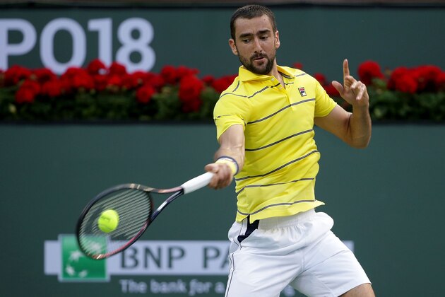 INDIAN WELLS, CA - MARCH 11:  Marin Cilic of Croatia returns a forehand to Marton Fucsovics of Hungary during the BNP Paribas Open on March 11, 2018 at the Indian Wells Tennis Garden in Indian Wells, California.  (Photo by Jeff Gross/Getty Images)