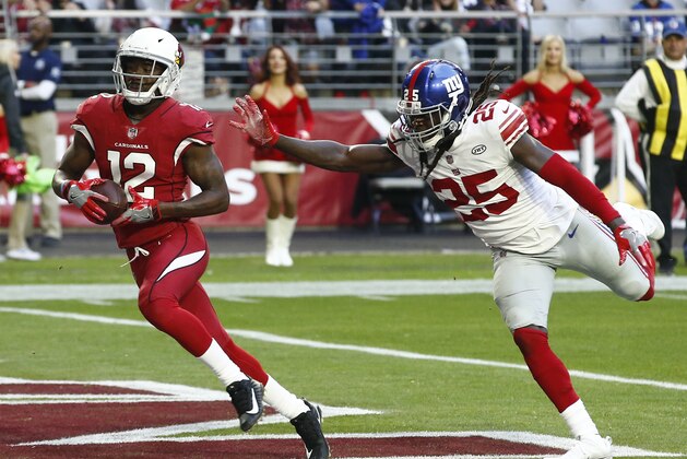Arizona Cardinals wide receiver John Brown (12) scores a touchdown as New York Giants defensive back Brandon Dixon (25) defends during the second half of an NFL football game, Sunday, Dec. 24, 2017, in Glendale, Ariz. (AP Photo/Ross D. Franklin)