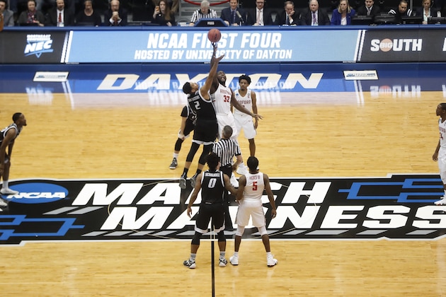 Radford's Randy Phillips (32) and LIU Brooklyn's Julius van Sauers (2) tip off during the first half of a First Four game of the NCAA men's college basketball tournament, Tuesday, March 13, 2018, in Dayton, Ohio. (AP Photo/John Minchillo)