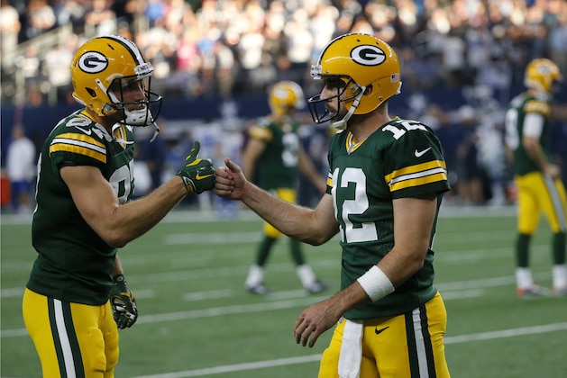 Green Bay Packers' Jordy Nelson (87) and Aaron Rodgers (12) celebrate a touchdown scored late in the second half of an NFL football game against the Dallas Cowboys on Sunday, Oct. 8, 2017, in Arlington, Texas. (AP Photo/Roger Steinman)