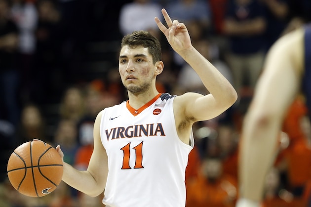 Virginia guard Ty Jerome (11) calls a play during the second half of an NCAA college basketball game in Charlottesville, Va., Saturday, March 3, 2018. Virginia won the game 62-57. (AP Photo/Steve Helber)