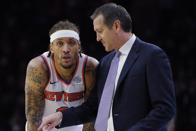 New York Knicks head coach Jeff Hornacek talks to Michael Beasley (8) in the first half of an NBA basketball game against the Philadelphia 76ers, Monday, Feb 12, 2018, in Philadelphia. (AP Photo/Michael Perez)