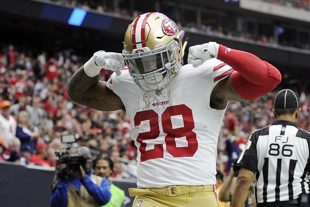 San Francisco 49ers running back Carlos Hyde celebrates after scoring a touchdown during the first half of an NFL football game against the Houston Texans, Sunday, Dec. 10, 2017, in Houston. (AP Photo/Eric Christian Smith)
