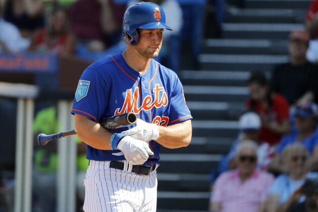 New York Mets' Tim Tebow walks back to the dugout after striking out during the second inning of an exhibition spring training baseball game against the Washington Nationals Friday, March 2, 2018, in Port St. Lucie, Fla. (AP Photo/Jeff Roberson)