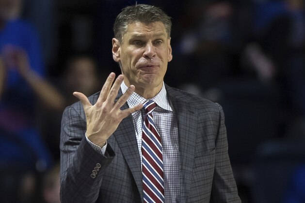 Loyola of Chicago head coach Porter Moser signals to his team during the first half of an NCAA college basketball game against Florida in Gainesville, Fla., Wednesday, Dec. 6, 2017. (AP Photo/Ron Irby)