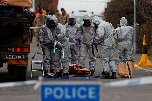 British Military personnel wearing protective coveralls work to remove a vehicle connected to the March 4 nerve agent attack in Salisbury, from a residential street in Gillingham, southeast England on March 14, 2018.
Britain will expel 23 Russian diplomats over the nerve agent attack on former double agent Sergei Skripal and his daughter Yulia, in England, Prime Minister Theresa May told lawmakers today.  / AFP PHOTO / Adrian DENNIS        (Photo credit should read ADRIAN DENNIS/AFP/Getty Images)