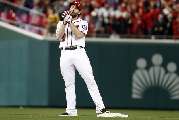 Washington Nationals' Daniel Murphy (20) reacts at second base after hitting a double during the sixth inning in Game 5 of baseball's National League Division Series against the Chicago Cubs, at Nationals Park, Thursday, Oct. 12, 2017 in Washington. Bryce Harper scored on the play. (AP Photo/Alex Brandon)