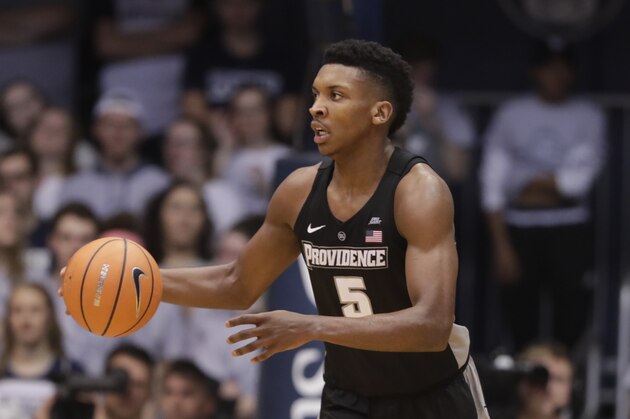 Providence forward Rodney Bullock (5) brings the ball up court against Butler in the second half of an NCAA college basketball game in Indianapolis, Saturday, Feb. 17, 2018. Butler defeated Providence 69-54. (AP Photo/Michael Conroy)