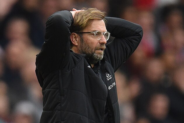 Liverpool's German manager Jurgen Klopp gestures on the touchline during the English Premier League football match between Manchester United and Liverpool at Old Trafford in Manchester, north west England, on March 10, 2018. / AFP PHOTO / Oli SCARFF / RESTRICTED TO EDITORIAL USE. No use with unauthorized audio, video, data, fixture lists, club/league logos or 'live' services. Online in-match use limited to 75 images, no video emulation. No use in betting, games or single club/league/player publications.  /         (Photo credit should read OLI SCARFF/AFP/Getty Images)
