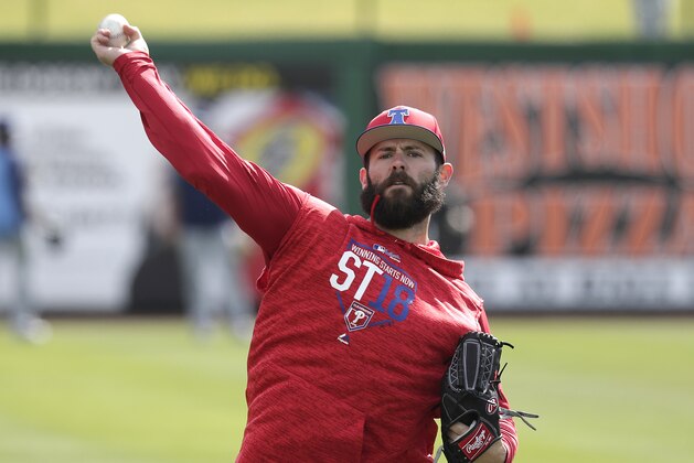 Philadelphia Phillies pitcher Jake Arrieta throws during a work out before a spring baseball exhibition game against the Tampa Bay Rays, Tuesday, March 13, 2018, in Clearwater, Fla. (AP Photo/John Raoux)