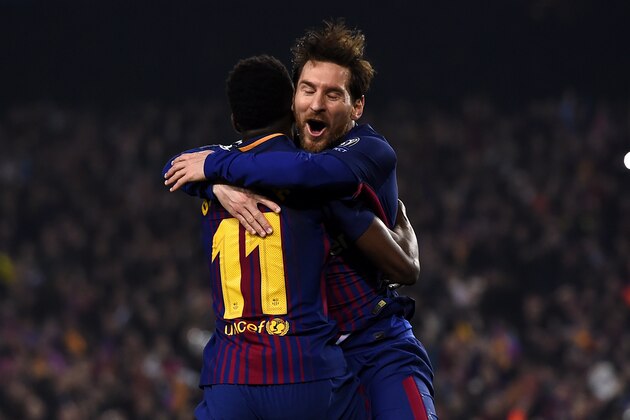 Barcelona's French forward Ousmane Dembele (L) celebrates with Barcelona's Argentinian forward Lionel Messi after scoring a goal during the UEFA Champions League round of sixteen second leg football match between FC Barcelona and Chelsea FC at the Camp Nou stadium in Barcelona on March 14, 2018. / AFP PHOTO / Josep LAGO        (Photo credit should read JOSEP LAGO/AFP/Getty Images)