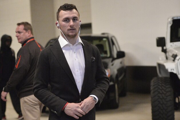 Cleveland Browns quarterback Johnny Manziel leaves the stadium after an NFL football game between the San Francisco 49ers and the Cleveland Browns, Sunday, Dec. 13, 2015, in Cleveland. (AP Photo/David Richard)