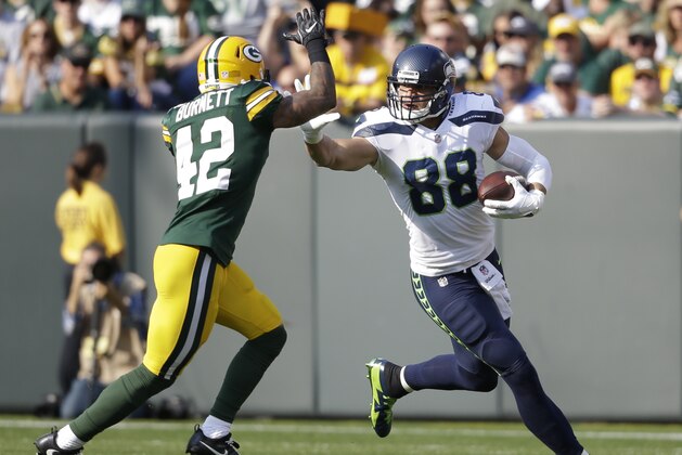 Seattle Seahawks' Jimmy Graham tries to get past Green Bay Packers' Morgan Burnett during the first half of an NFL football game Sunday, Sept. 10, 2017, in Green Bay, Wis. (AP Photo/Jeffrey Phelps)