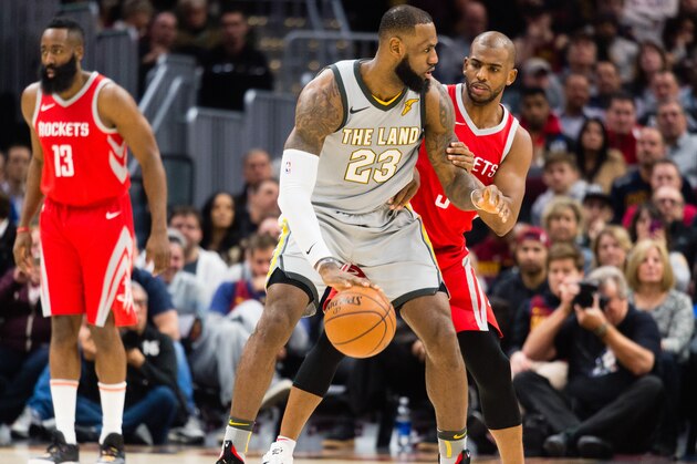 CLEVELAND, OH - FEBRUARY 3: LeBron James #23 of the Cleveland Cavaliers tries to drive around Chris Paul #3 of the Houston Rockets during the first half at Quicken Loans Arena on February 3, 2018 in Cleveland, Ohio. NOTE TO USER: User expressly acknowledges and agrees that, by downloading and or using this photograph, User is consenting to the terms and conditions of the Getty Images License Agreement. (Photo by Jason Miller/Getty Images)