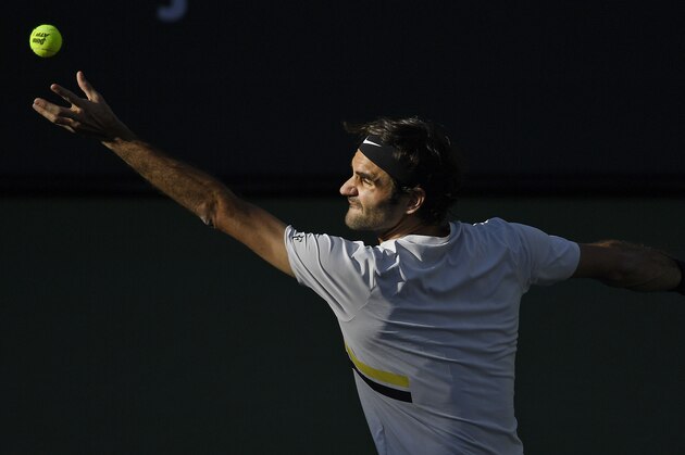 Roger Federer, of Switzerland, serves to Jeremy Chardy, of France, at the BNP Paribas Open tennis tournament Wednesday, March 14, 2018, in Indian Wells, Calif. (AP Photo/Mark J. Terrill)
