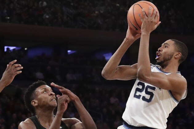 Villanova's Mikal Bridges (25) shoots over Providence's Rodney Bullock (5) during the first half of an NCAA college basketball game in the Big East men's tournament final Saturday, March 10, 2018, in New York. (AP Photo/Frank Franklin II)