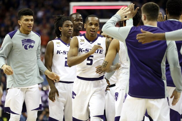 KANSAS CITY, MO - MARCH 08:  Barry Brown #5 of the Kansas State Wildcats celebrates with teammates after the Wildcats defeated the TCU Horned Frogs in overtime to win the Big 12 Basketball Tournament quarterfinal game at the Sprint Center on March 8, 2018 in Kansas City, Missouri.  (Photo by Jamie Squire/Getty Images)