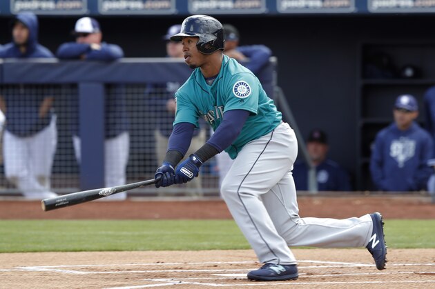 Seattle Mariners shortstop Jean Segura watches a single during the first inning of a spring training baseball game against the San Diego Padres, Friday, Feb. 23, 2018, in Peoria, Ariz. (AP Photo/Charlie Neibergall)