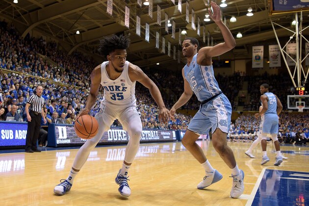 DURHAM, NC - MARCH 03: Marvin Bagley III #35 of the Duke Blue Devils moves the ball against Garrison Brooks #15 of the North Carolina Tar Heels at Cameron Indoor Stadium on March 3, 2018 in Durham, North Carolina. Duke won 74-64. (Photo by Lance King/Getty Images)