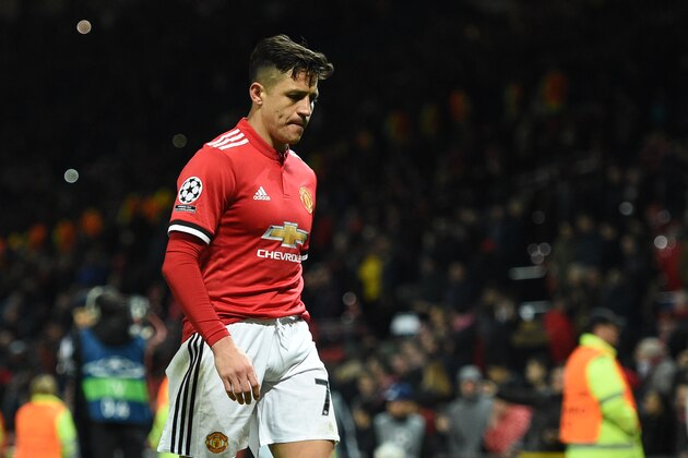 Manchester United's Chilean striker Alexis Sanchez leaves the pitch after losing a last 16 second leg UEFA Champions League football match between Manchester United and Sevilla at Old Trafford in Manchester, northwest England on March 13, 2018. / AFP PHOTO / Oli SCARFF        (Photo credit should read OLI SCARFF/AFP/Getty Images)