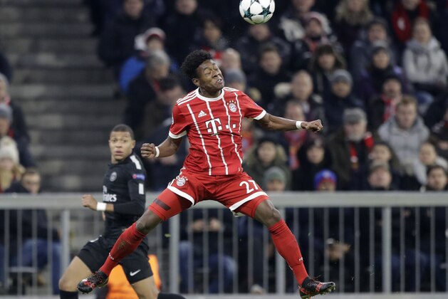 Bayern's David Alaba heads a ball during the Champions League Group B soccer match between FC Bayern Munich and Paris Saint-Germain, at Allianz Arena stadium in Munich, Germany, Tuesday, Dec. 5, 2017. (AP Photo/Matthias Schrader)
