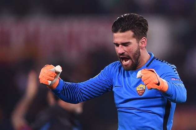Roma's Brazilian goalkeeper Alisson celebrates afer winning 1-0 the UEFA Champions League round of 16 second leg football match AS Roma vs Shakhtar Donetsk on March 13, 2018 at the Olympic stadium in Rome. 
Roma reached the Champions League quarter-finals for the first time in 10 years as Edin Dzeko edged them past Shakhtar Donetsk 1-0 at the Stadio Olimpico on Tuesday for an away goals victory. / AFP PHOTO / Filippo MONTEFORTE        (Photo credit should read FILIPPO MONTEFORTE/AFP/Getty Images)