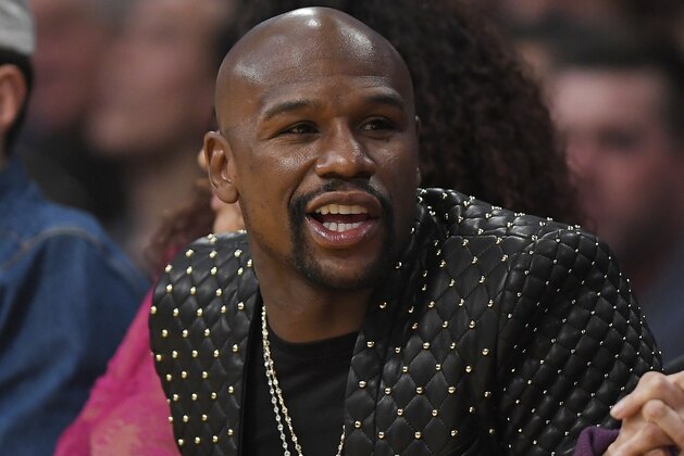 Boxer Floyd Mayweather Jr. watches during the second half of an NBA basketball game between the Los Angeles Lakers and the Los Angeles Clippers, Thursday, Oct. 19, 2017, in Los Angeles. The Clippers won 108-92. (AP Photo/Mark J. Terrill)