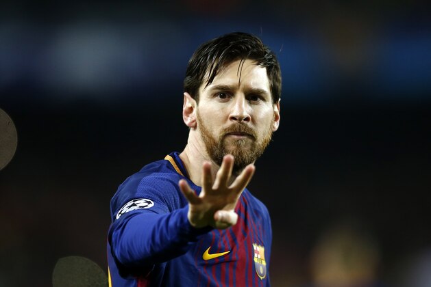 Barcelona's Lionel Messi gestures after scoring the opening goal during the Champions League round of sixteen second leg soccer match between FC Barcelona and Chelsea at the Camp Nou stadium in Barcelona, Spain, Wednesday, March 14, 2018. (AP Photo/Manu Fernandez)