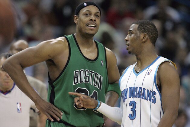 Boston Celtics guard Paul Pierce (34) and New Orleans Hornets guard Chris Paul (3) talk during a break in the action in the second half of their NBA basketball game in New Orleans, Wednesday, Feb. 11, 2009. The Celtics defeated the Hornets 89-77. (AP Photo/Bill Haber)