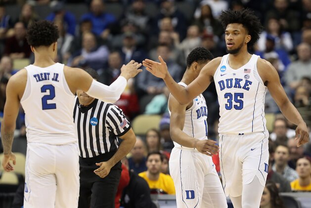 PITTSBURGH, PA - MARCH 15:  Marvin Bagley III #35 of the Duke Blue Devils celebrates with teammate Gary Trent Jr. #2 after hitting a three pointer against the Iona Gaels during the first half of the game in the first round of the 2018 NCAA Men's Basketball Tournament at PPG PAINTS Arena on March 15, 2018 in Pittsburgh, Pennsylvania.  (Photo by Rob Carr/Getty Images)